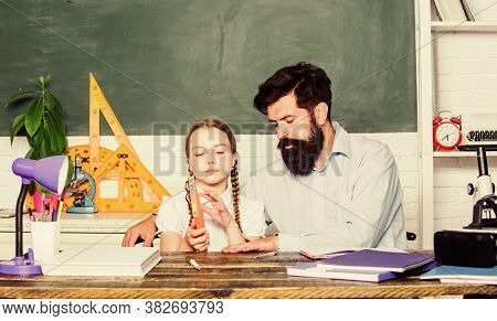 Fascinating Lesson. Explaining Science To Child. School Teacher And Schoolgirl. Man Bearded Teacher 