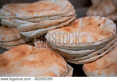 Kuboos Or Khubz - Fresh Pita Bread Togeather In A Table Table