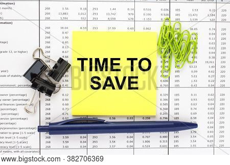 Text Time To Save On Financial Tables With Pen And Paper Clips