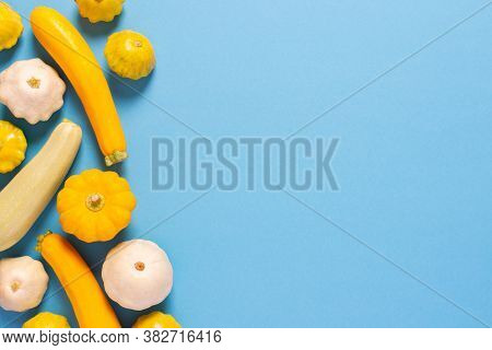 Fresh Harvest Of Zucchini And Pattison, Yellow Squash And Pattison On Blue Background