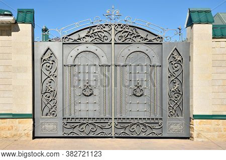 Wrought Iron Gates With Decor.. Facade Of The House.
