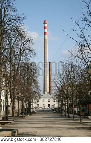 Breclav, Czechia - March 16, 2013: Main Street Of Breclav, With Its Iconic Giant Chimney From The In