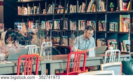 Bangkok-thailand, July 14, 2020: Unidentified Customers Work On Computer With Smartphone And Relax W