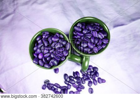 Ceramic Cups With Roasted Coffee Beans On A Table