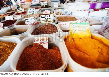 Different Colorful Spices Background. Various Colored Spices On The Mahane Yehuda Market In Jerusale