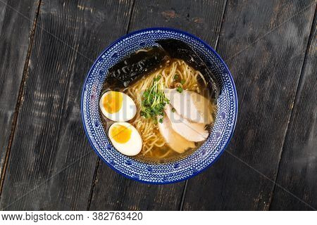 Top View On Asian Japanese Shio Ramen Noodle Soup With Pickled Agitama Egg And Chicken Breast On The