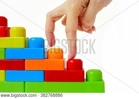 Step By Step To The Top. Business Concept Of Successful Financial Growth. The Womans Hand Steps On T