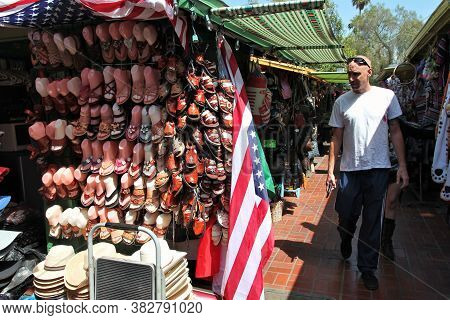 Los Angeles, Usa - April 5, 2014: People Visit Olvera Street Market In Los Angeles. Olvera Street Is
