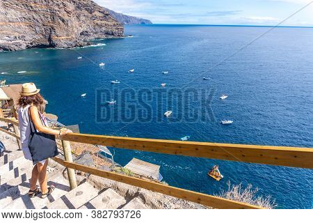 A Young Tourist Descending The Stairs To Reach The Cove Of Puerto De Puntagorda, Island Of La Palma,
