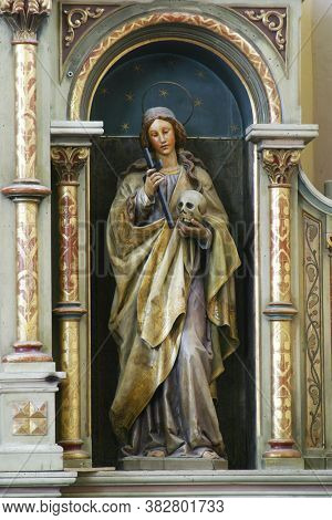 SVETI IVAN ZELINA, CROATIA - JUNE 26, 2013: Saint Apollonia statue at the Altar of Our Lady of Sorrows in the parish church of Saint John the Baptist in Sveti Ivan Zelina, Croatia