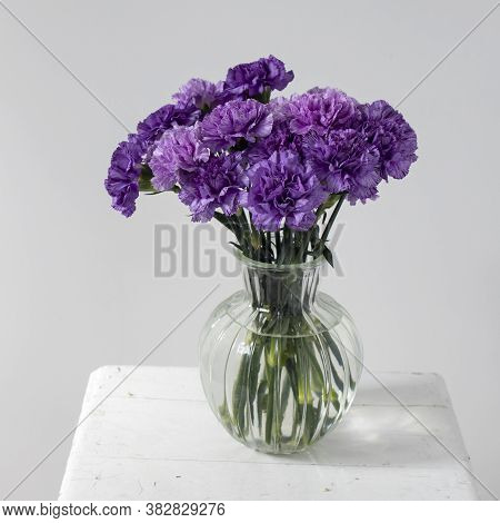 Bridal Bouquets Of Lilac Carnations In A Four Round Glass Vases Different Sizes As Table Decoration
