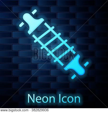 Glowing Neon Bicycle Suspension Icon Isolated On Brick Wall Background. Vector