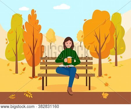 Woman With Book And Cap Of Hot Coffee Or Tea Sitting On The Bench In Park. Autumn City Park Backgrou