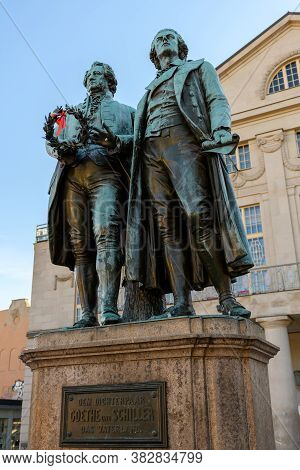 Weimar, Thuringia, Germany: Monument Of The Famous Writers Goethe And Schiller In Front Of The Germa