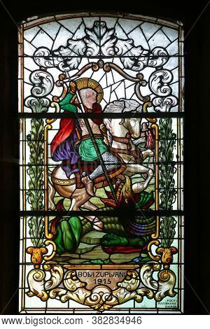 PESCENICA, CROATIA - SEPTEMBER 07, 2013: Saint George, stained glass window in Parish Church of the Assumption of the Virgin Mary in Pescenica, Croatia