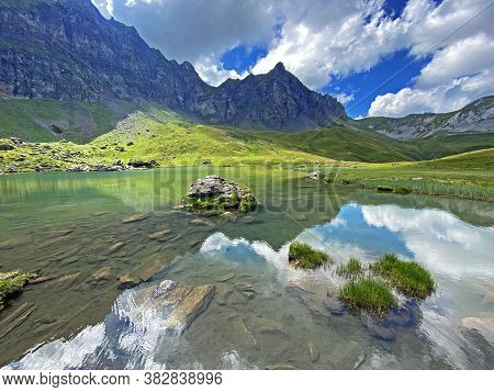 The Alpine Lake Blausee Or Blue Lake In The Uri Alps Mountain Massif, Melchtal - Canton Of Obwald, S