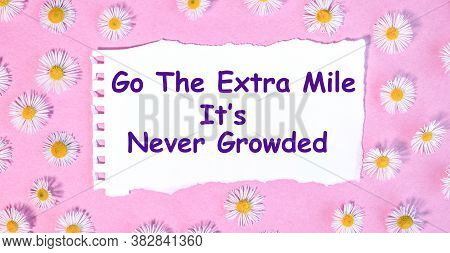 Go The Extra Mile It Is Never Growded. Beautiful Picture On White Paper Against A Pink Background On