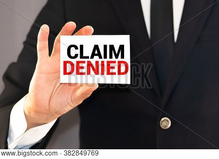 Claim Denied Words On A Card In Hand Of Businessman. Business Agreement Termination Or Sponsorship P