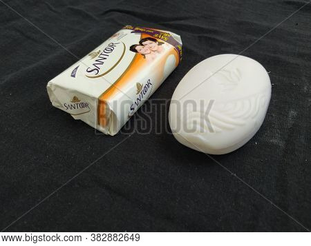 Closeup Of Pack Opened And Closed White Color Santoor Sandal And Almond Milk Soap Bar Isolated On Bl
