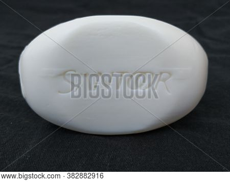 Closeup Of Pack Opened And Closed White Color Santoor Sandal And Almond Milk Soap Bar Isolated On Bl