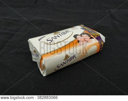 Closeup Of Pack Opened And Closed White Color Santoor Sandal And Almond Milk Soap Bar Isolated On Bl