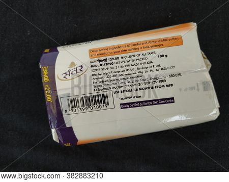 Closeup Of Pack Opened And Closed White Color Santoor Sandal And Almond Milk Soap Bar Isolated On Bl