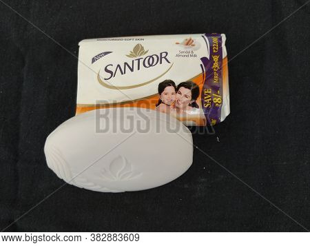Closeup Of Pack Opened And Closed White Color Santoor Sandal And Almond Milk Soap Bar Isolated On Bl