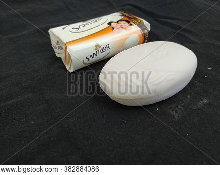 Closeup Of Pack Opened And Closed White Color Santoor Sandal And Almond Milk Soap Bar Isolated On Bl