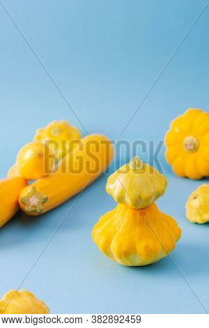 Fresh Harvest Of Zucchini And Pattypan Squash, Yellow Squash And Pattison On Blue Background