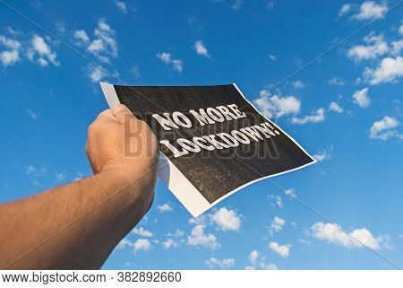 Lockdown Financial And Social Crisis Concept. A Hand Holding A Banner With The Message 