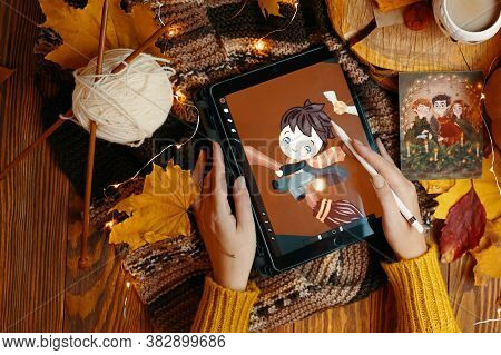 Young Woman In A Sweater Draws On A Ipad Pro In Procreate App Harry Potter Is Playing Quidditch On A