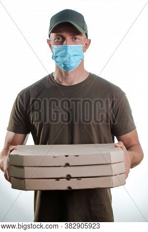 Young Handsome Man Delivering Pizza. Pizza Box.