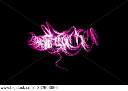 Abstract Neon Lights Trails In The Black Background. Futuristic Overlay Light Pattern.