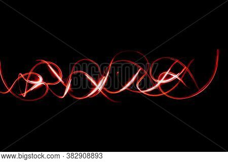 Abstract Neon Lights Trails In The Black Background. Futuristic Overlay Light Pattern.