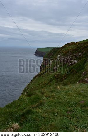 Grass Covered Sea Cliffs Along The Coast Of St Bees In England.
