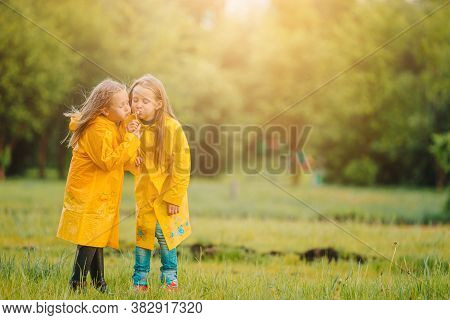 Adorable Little Girls Under The Rain On Warm Spring Day