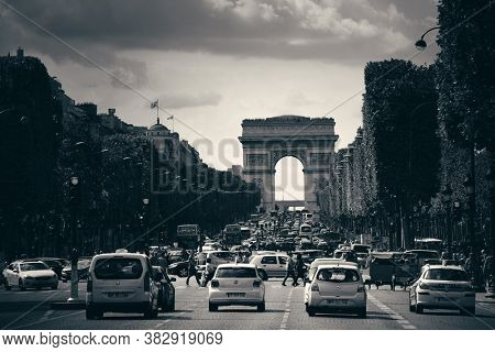 PARIS, FRANCE - MAY 13: street view and Arc de Triomphe on May 13, 2015 in Paris. With the population of 2M, Paris is the capital and most-populous city of France