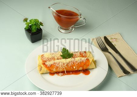 Meat Pancake With Red Sauce And Parmesan Cheese
