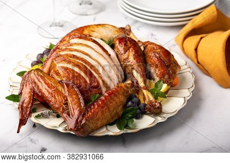 Carved Roasted Turkey For The Calebration Thanksgiving Or Christmas Dinner On A Plate