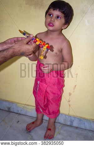 Cute Indian Kid Dressed Up As Little Lord Krishna On The Occasion Of Radha Krishna Janmastami Festiv