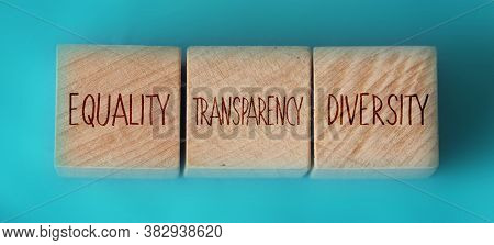 Equality Transparency Diversity Words Written On Wooden Cubes On Aquamarine Background. Equal Rights