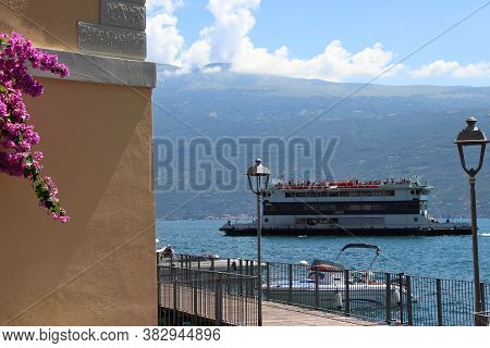 Lake Garda, Brescia,  Italy - 07/ 30/ 2020: An old paddle steamer boat on  Garda lake