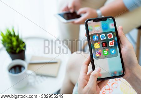 Bangkok, Thailand - August 30, 2020 : Hand Using Iphone Of Show Display App Social Media Screen. The