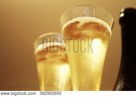 Bottle Of Shampagne And A Two Glasses Full Of Cold Shampagne Before Drinking Isolated