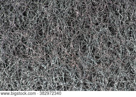 Dark Abstract Background And Pattern Of Interwoven Hairs, Fibers And Nanofibers. Sponge Detail Textu