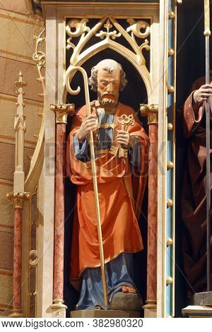 DESINIC, CROATIA - OCTOBER 18, 2013: Saint Peter, a statue on a high altar in the parish church of Saint George in Desinic, Croatia