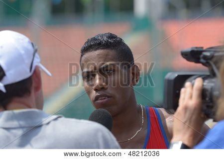 DONETSK, UKRAINE - JULY 12: Reynier Mena of Cuba win the heat in 200 metres during 8th IAAF World Youth Championships in Donetsk, Ukraine on July 12, 2013