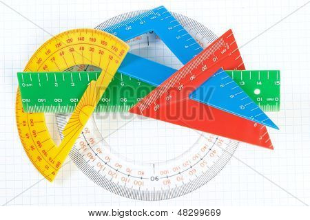 A Set Of Colored Triangles And Lines Protractors For Drawing. On A White Background.