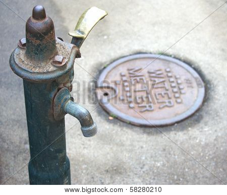 Outdoor water spigot and water meter