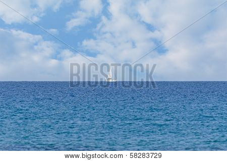 Peaceful Ocean Landscape With A White Yacht Afar Off